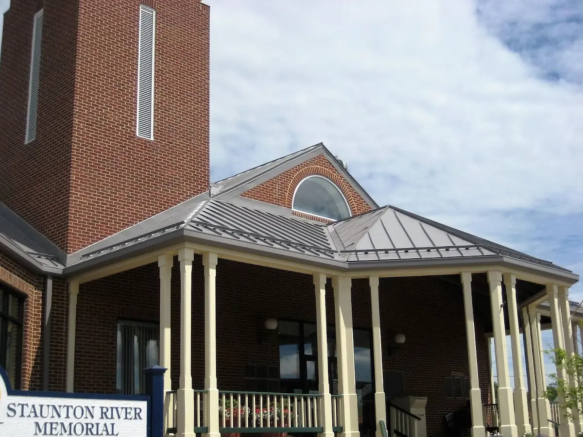 Skilled roofing craftsmen working on a residential roof in Adairsville